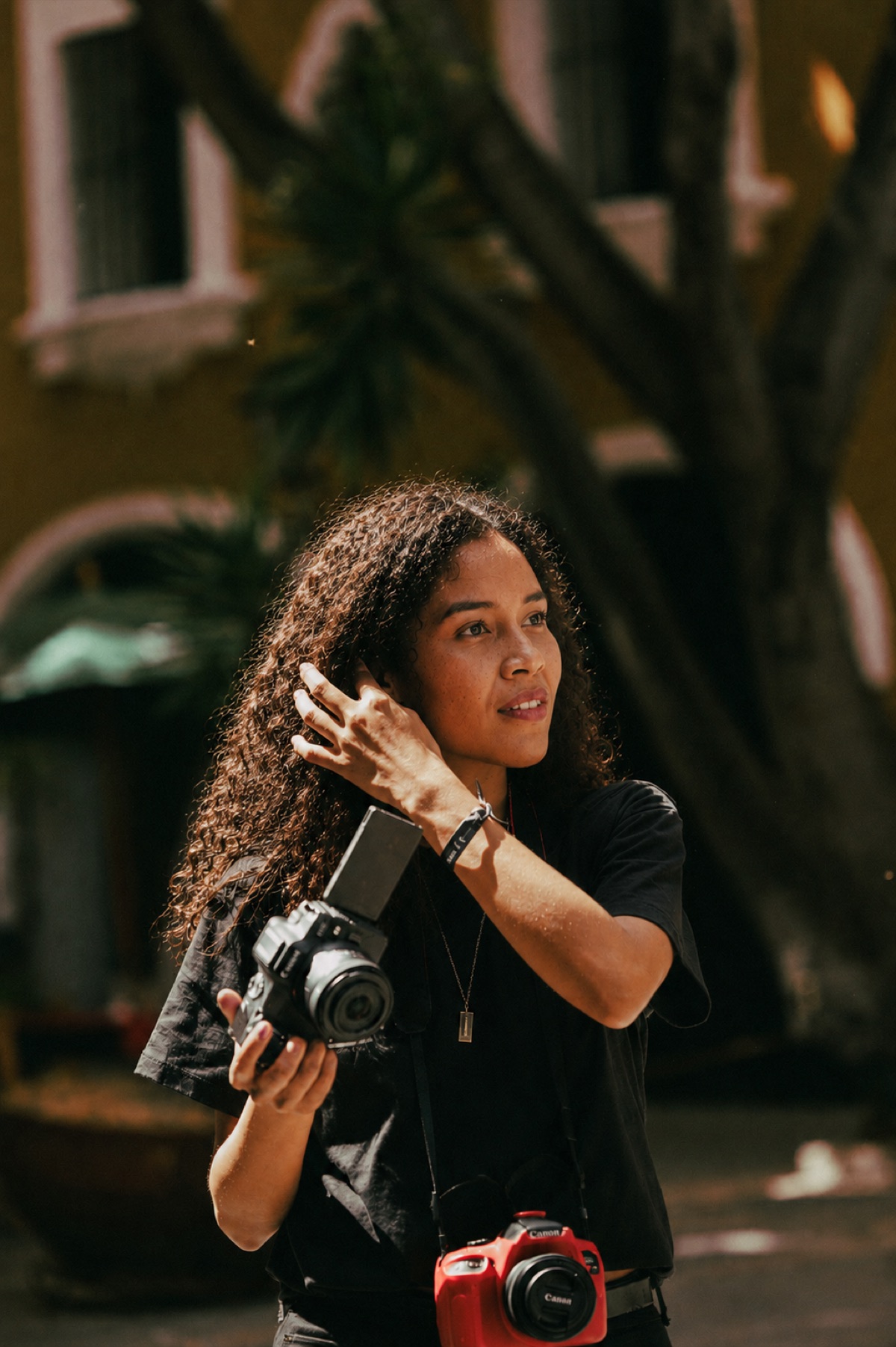 A photographer with her camera, ready to shoot